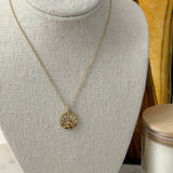 Gold necklace with sunshine pendant