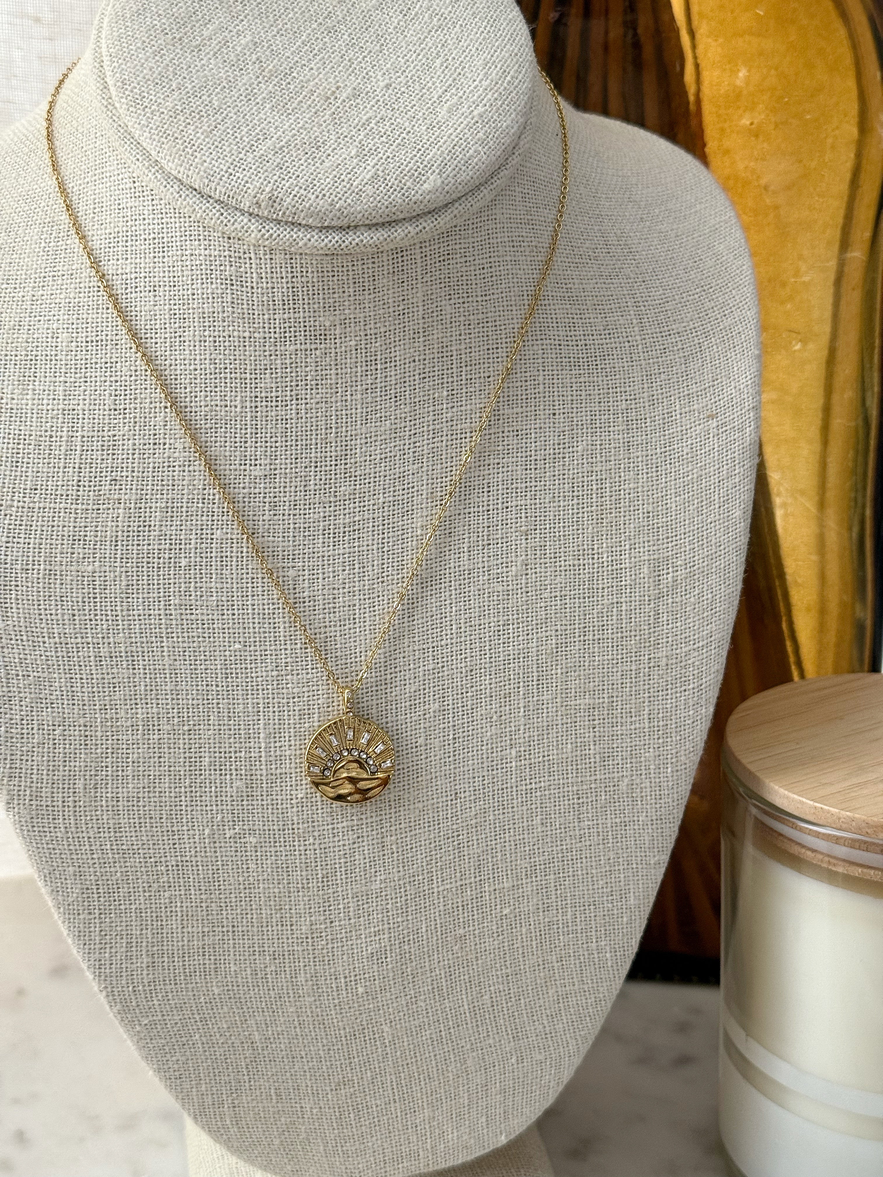 Gold necklace with sunshine pendant