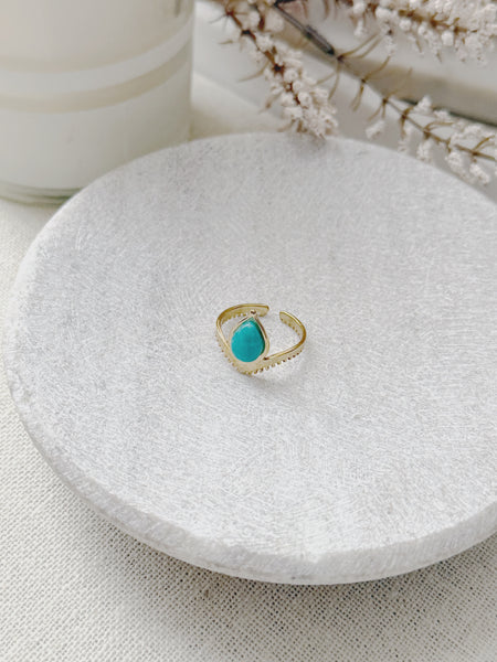 Gold ring with a turquoise stone