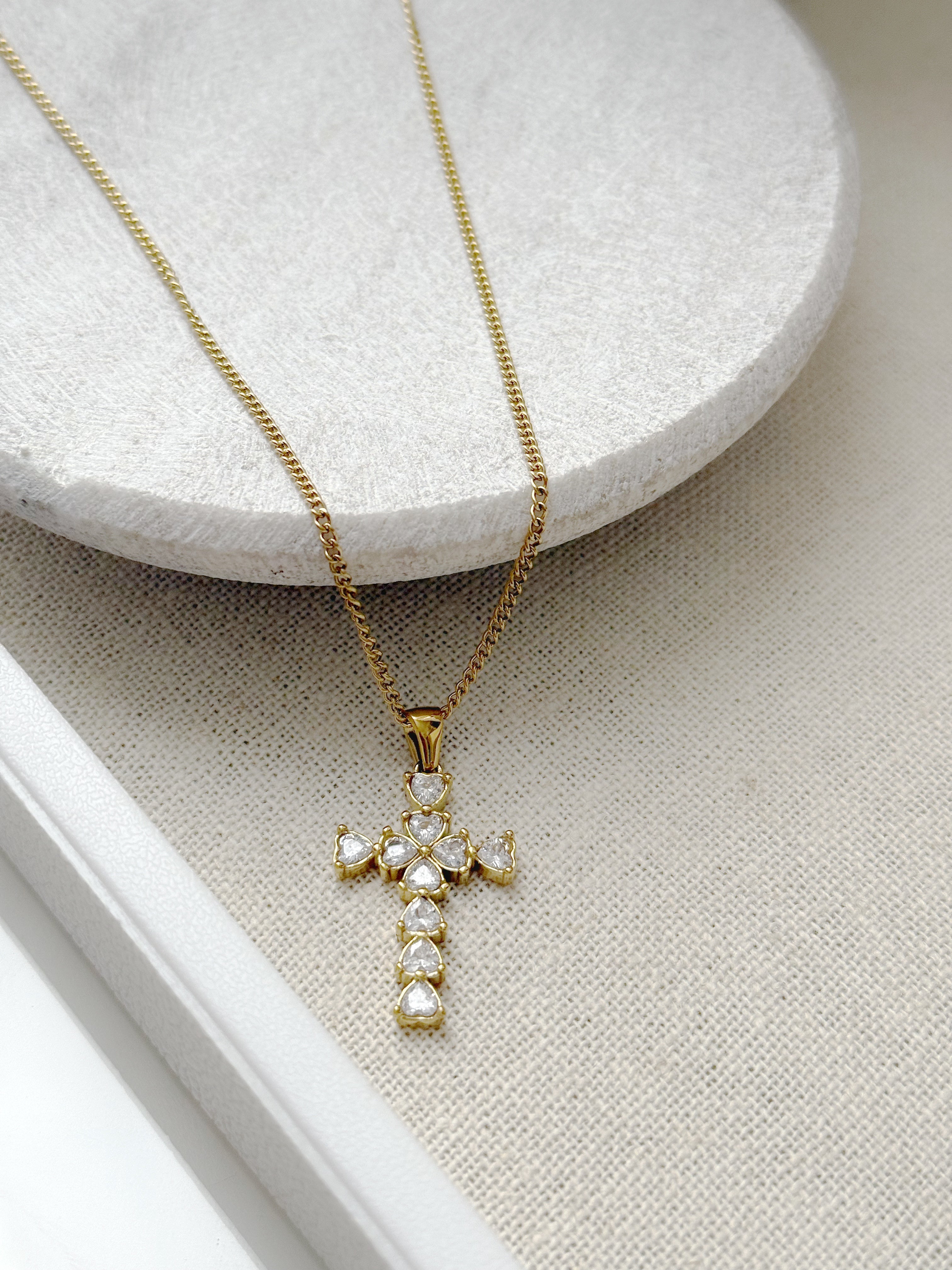 Gold cross necklace with clear stones