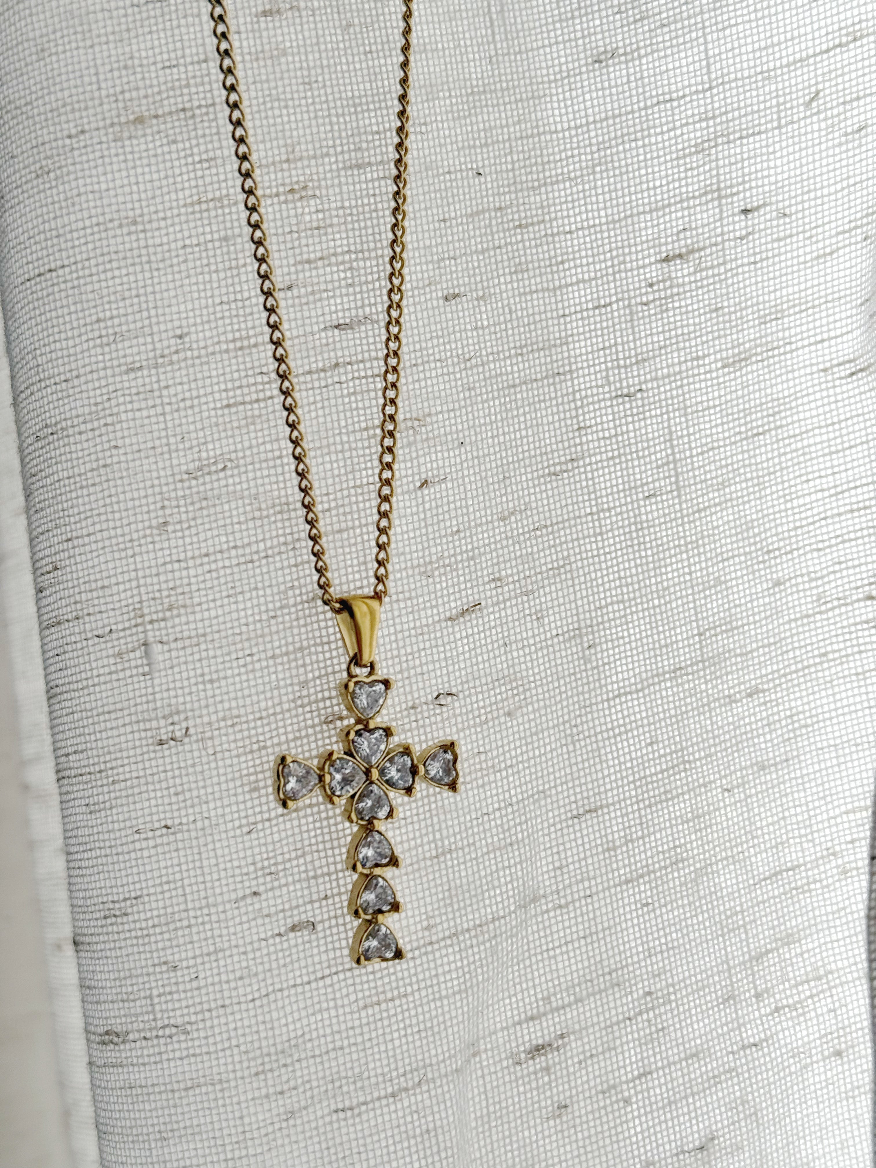 Gold cross necklace with clear stones